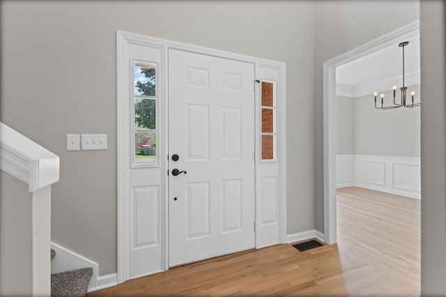 236 Comer Cir, Murfreesboro, TN 37128 - foyer with a chandelier, wood finished floors, and stairway