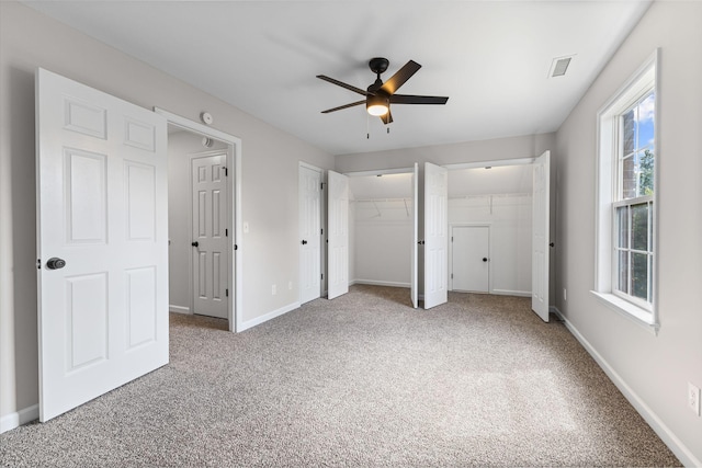 236 Comer Cir, Murfreesboro, TN 37128 - unfurnished bedroom with carpet, two closets, and ceiling fan