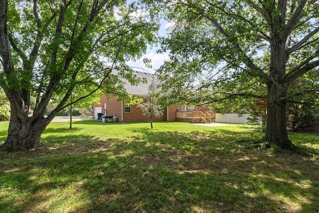 236 Comer Cir, Murfreesboro, TN 37128 - view of green lawn with a wooden deck