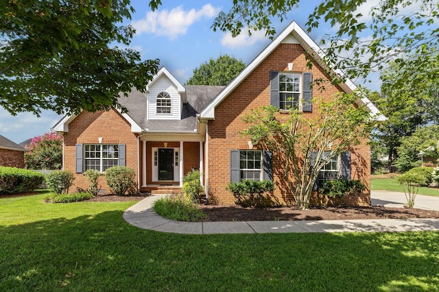 236 Comer Cir, Murfreesboro, TN 37128 - traditional-style home featuring brick siding, a front yard, and roof with shingles
