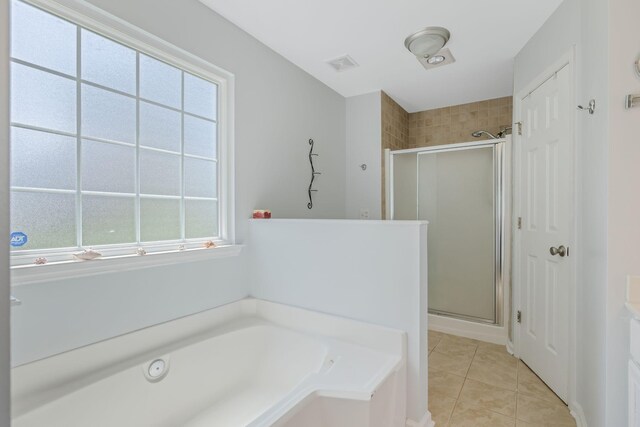 2117 Spring Hill Cir, Spring Hill, TN 37174 - full bathroom with a stall shower, a bath, tile patterned flooring, and vanity