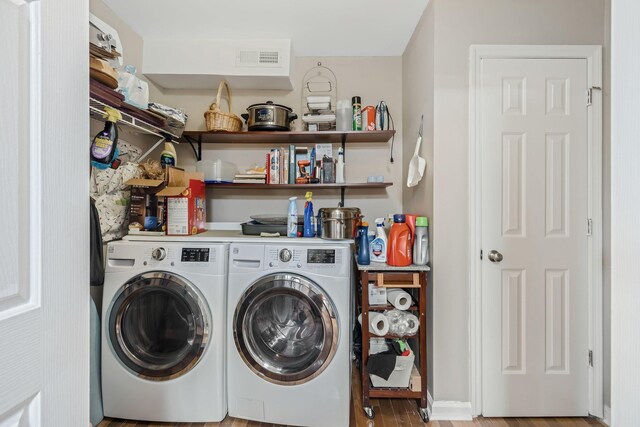 2117 Spring Hill Cir, Spring Hill, TN 37174 - laundry room featuring independent washer and dryer and wood finished floors