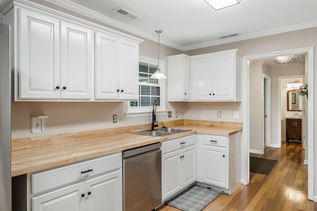 2117 Spring Hill Cir, Spring Hill, TN 37174 - kitchen featuring dishwasher, wooden counters, light wood-type flooring, white cabinets, and crown molding