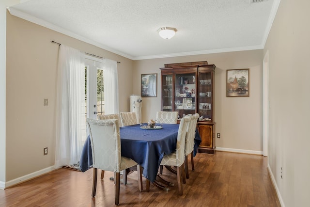 2117 Spring Hill Cir, Spring Hill, TN 37174 - dining space with wood finished floors, ornamental molding, and a textured ceiling