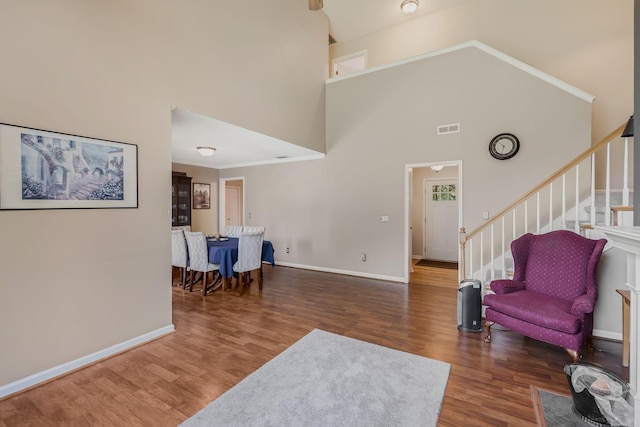 2117 Spring Hill Cir, Spring Hill, TN 37174 - living room with a high ceiling, wood finished floors, stairs, and ornamental molding