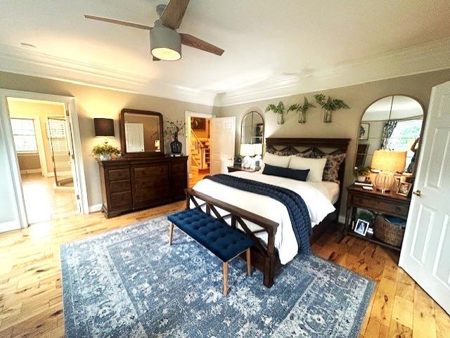 529 Derby Downs, Lebanon, TN 37087 - bedroom featuring crown molding, wood finished floors, a ceiling fan, and arched walkways