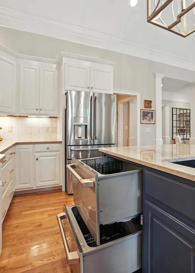 529 Derby Downs, Lebanon, TN 37087 - kitchen featuring stainless steel fridge with ice dispenser, decorative backsplash, white cabinetry, ornamental molding, and recessed lighting