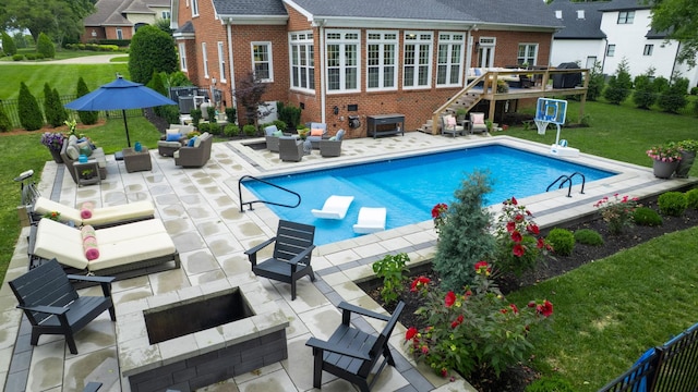 529 Derby Downs, Lebanon, TN 37087 - swimming pool with an outdoor living space with a fire pit, a lawn, a patio, and a deck
