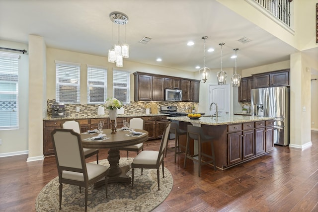 654 Foster Ln, Mount Juliet, TN 37122 - kitchen featuring stainless steel appliances, a chandelier, dark brown cabinetry, dark wood-type flooring, and recessed lighting