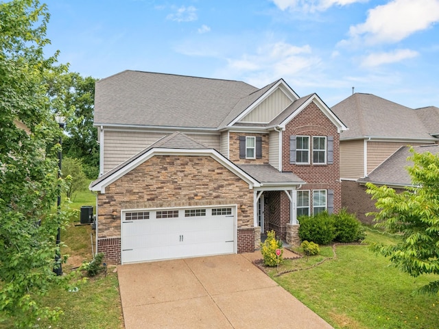 654 Foster Ln, Mount Juliet, TN 37122 - craftsman house with a front lawn, concrete driveway, stone siding, and an attached garage