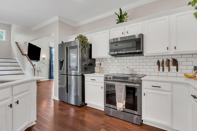 1016 Nealcrest Cir, Spring Hill, TN 37174 - kitchen with stainless steel appliances, light countertops, backsplash, dark wood-style flooring, and ornamental molding
