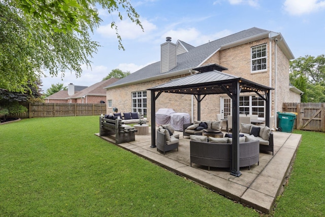 1016 Nealcrest Cir, Spring Hill, TN 37174 - back of property featuring an outdoor hangout area, brick siding, a gazebo, a chimney, and a fenced backyard