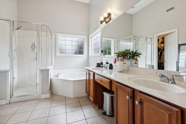 1016 Nealcrest Cir, Spring Hill, TN 37174 - bathroom featuring a stall shower, double vanity, a bath, and healthy amount of natural light