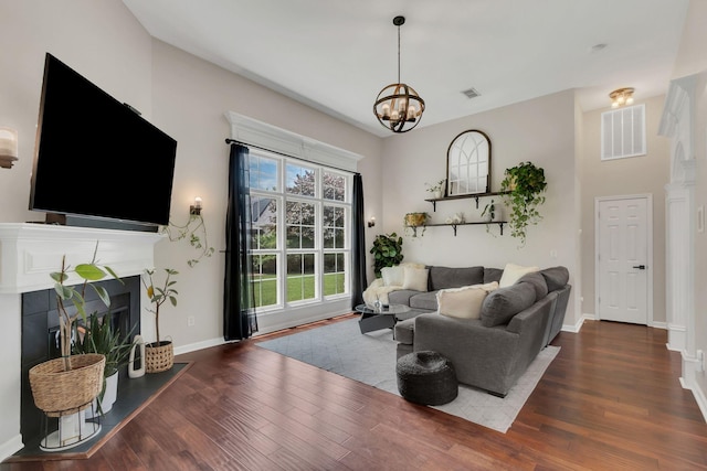 1016 Nealcrest Cir, Spring Hill, TN 37174 - living area featuring wood finished floors, a fireplace, and a chandelier
