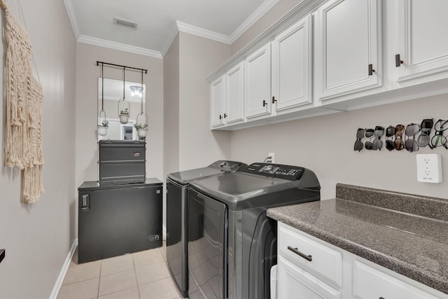 1016 Nealcrest Cir, Spring Hill, TN 37174 - laundry area featuring independent washer and dryer, ornamental molding, cabinet space, and light tile patterned flooring