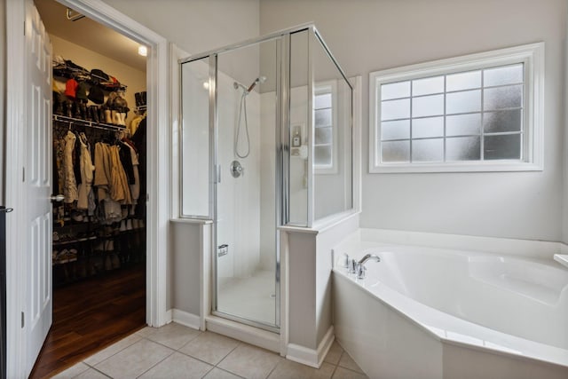 1016 Nealcrest Cir, Spring Hill, TN 37174 - full bath with a shower stall, a bath, a walk in closet, and tile patterned floors