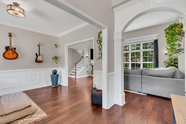1016 Nealcrest Cir, Spring Hill, TN 37174 - entrance foyer featuring ornate columns, dark wood-style floors, wainscoting, stairway, and crown molding