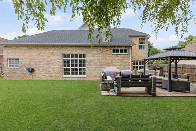 1016 Nealcrest Cir, Spring Hill, TN 37174 - back of property featuring outdoor lounge area, a gazebo, a patio area, a shingled roof, and brick siding