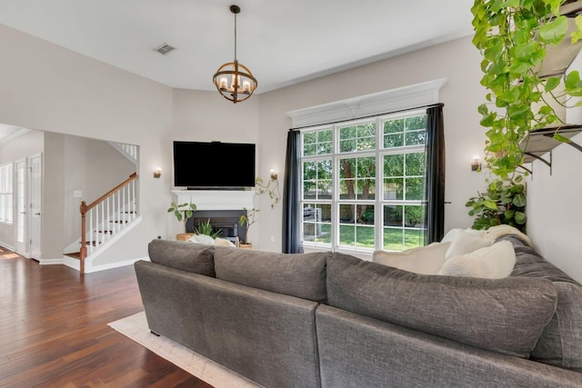 1016 Nealcrest Cir, Spring Hill, TN 37174 - living area with wood finished floors, stairway, healthy amount of natural light, and a chandelier