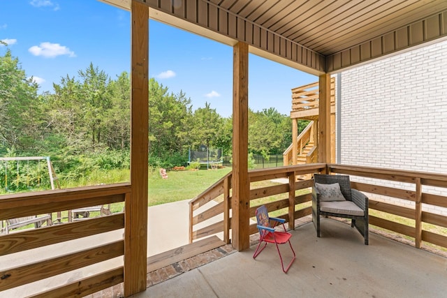 2428 Sandstone Cir, Murfreesboro, TN 37130 - view of patio featuring a trampoline, stairs, a wooden deck, and view of wooded area