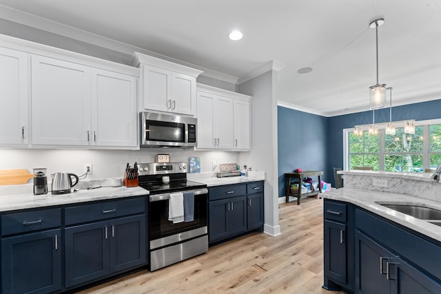 2428 Sandstone Cir, Murfreesboro, TN 37130 - kitchen featuring appliances with stainless steel finishes, ornamental molding, white cabinets, blue cabinetry, and light wood-type flooring