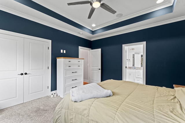 2428 Sandstone Cir, Murfreesboro, TN 37130 - carpeted bedroom featuring a raised ceiling, ornamental molding, a closet, ensuite bathroom, and a ceiling fan