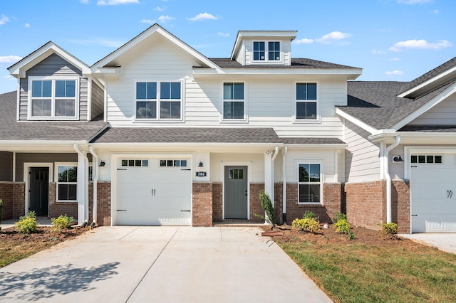 522 Rohan Dr, Murfreesboro, TN 37129 - view of front of property featuring brick siding, concrete driveway, roof with shingles, and an attached garage