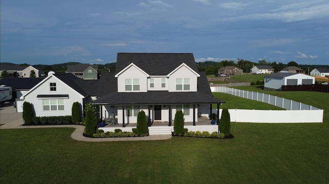 150 Bryson Ln, Castalian Springs, TN 37031 - view of front facade with a residential view, covered porch, a fenced backyard, and roof with shingles