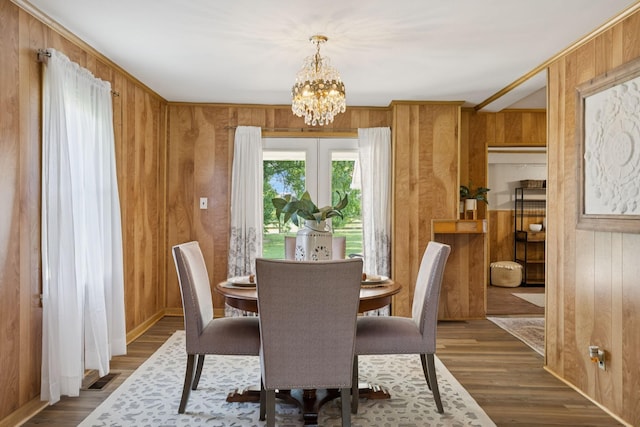 2274 Indian Mound Rd, Woodlawn, TN 37191 - dining room with wood walls, a chandelier, and wood finished floors