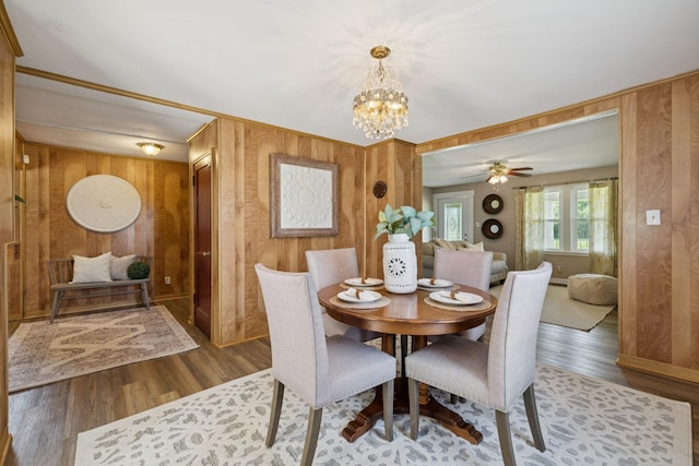 2274 Indian Mound Rd, Woodlawn, TN 37191 - dining space with wood walls, a chandelier, wood finished floors, and ceiling fan
