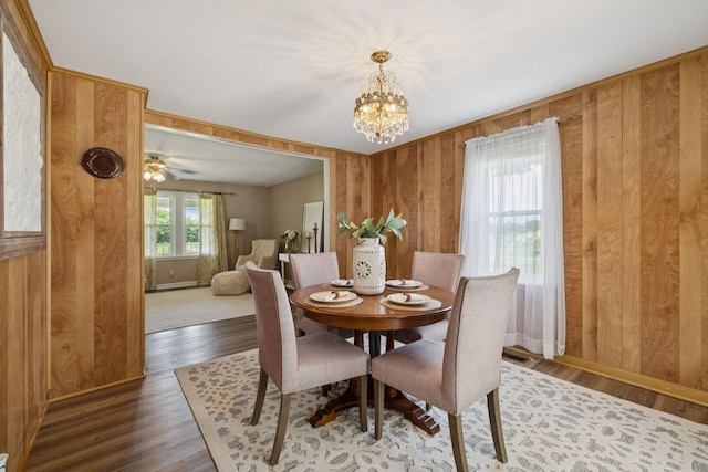 2274 Indian Mound Rd, Woodlawn, TN 37191 - dining space featuring wood walls, a chandelier, and wood finished floors