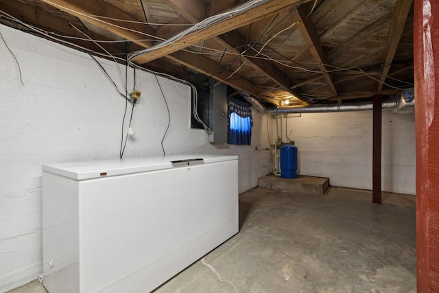 2274 Indian Mound Rd, Woodlawn, TN 37191 - unfinished below grade area featuring a water pressure tank and fridge