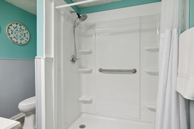2274 Indian Mound Rd, Woodlawn, TN 37191 - full bathroom with curtained shower, wainscoting, and wood finished floors