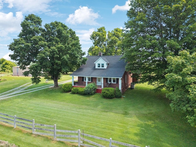2274 Indian Mound Rd, Woodlawn, TN 37191 - cape cod house with covered porch, a chimney, and brick siding