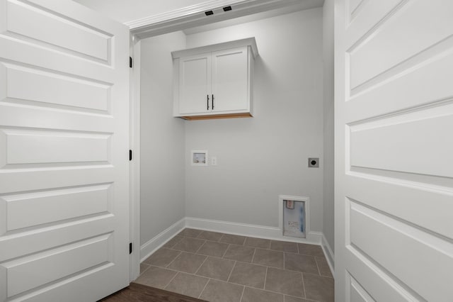 508 Rohan Dr, Murfreesboro, TN 37129 - laundry room with cabinet space, electric dryer hookup, hookup for a washing machine, and dark tile patterned floors