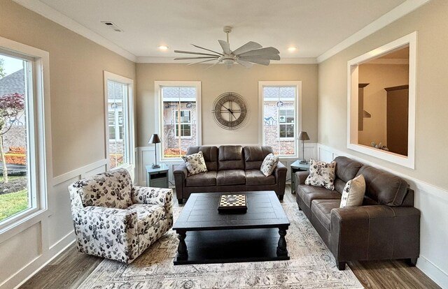 508 Rohan Dr, Murfreesboro, TN 37129 - living room featuring wood finished floors, a wainscoted wall, a decorative wall, a ceiling fan, and ornamental molding