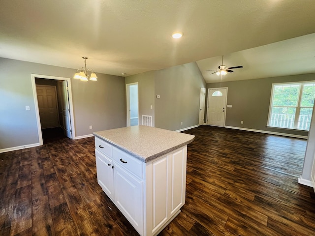 301 Union Hollow Rd, Petersburg, TN 37144 - kitchen featuring dark wood-type flooring, a chandelier, white cabinetry, a center island, and vaulted ceiling