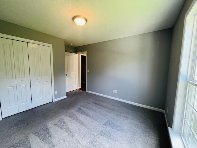 301 Union Hollow Rd, Petersburg, TN 37144 - unfurnished bedroom with dark carpet and a closet