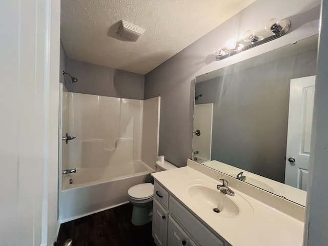 301 Union Hollow Rd, Petersburg, TN 37144 - full bathroom featuring vanity, a textured ceiling, wood finished floors, and washtub / shower combination