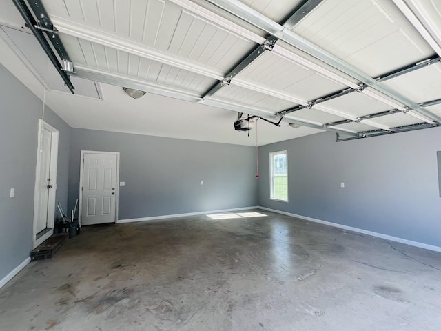 301 Union Hollow Rd, Petersburg, TN 37144 - garage with baseboards and a garage door opener