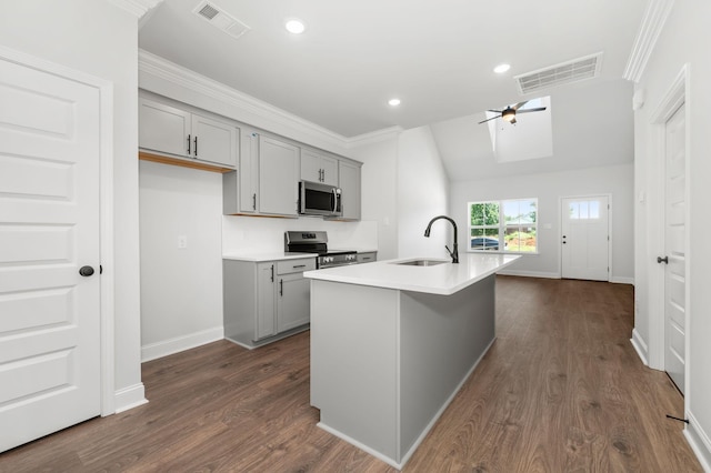510 Rohan Dr, Murfreesboro, TN 37129 - kitchen with gray cabinetry, stainless steel appliances, ceiling fan, light countertops, and ornamental molding