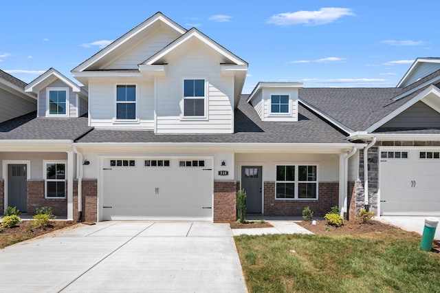 510 Rohan Dr, Murfreesboro, TN 37129 - craftsman house with brick siding, concrete driveway, a shingled roof, and a garage