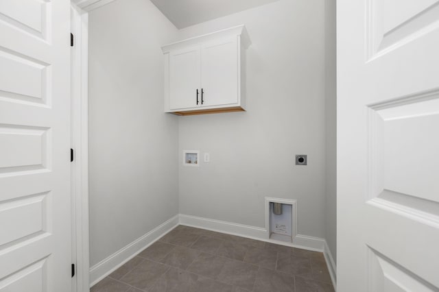 512 Rohan Dr, Murfreesboro, TN 37129 - laundry room featuring hookup for an electric dryer, washer hookup, cabinet space, and dark tile patterned floors