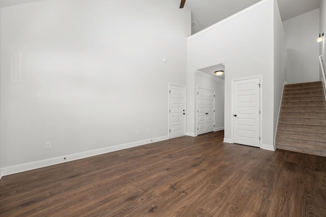 512 Rohan Dr, Murfreesboro, TN 37129 - unfurnished room with stairway, dark wood-style flooring, and high vaulted ceiling