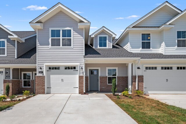 512 Rohan Dr, Murfreesboro, TN 37129 - view of front of house featuring brick siding, concrete driveway, and a garage