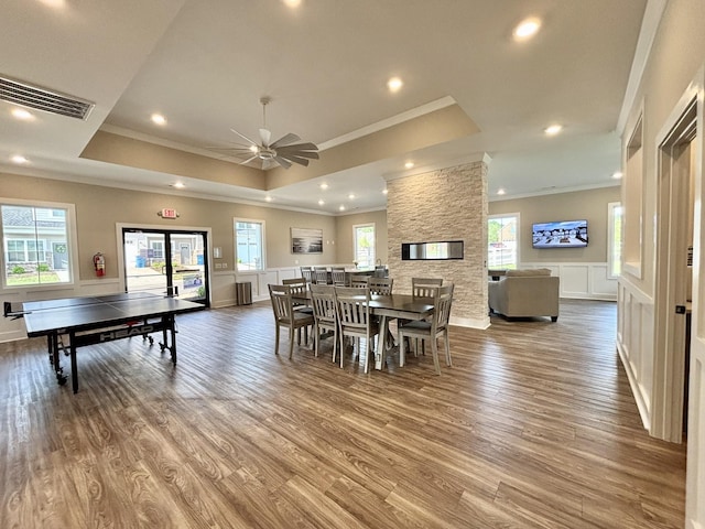 512 Rohan Dr, Murfreesboro, TN 37129 - dining area featuring crown molding, a raised ceiling, wood finished floors, a ceiling fan, and recessed lighting