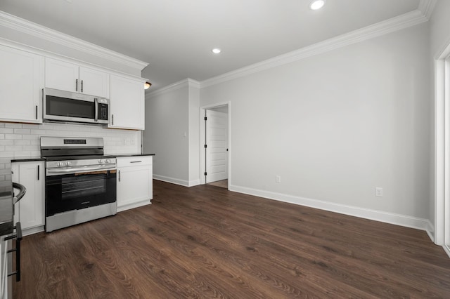 512 Rohan Dr, Murfreesboro, TN 37129 - kitchen featuring stainless steel appliances, dark countertops, ornamental molding, tasteful backsplash, and white cabinets
