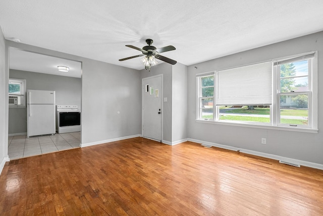 211 Navaho Trl, Hopkinsville, KY 42240 - unfurnished living room with light wood-style flooring and a ceiling fan