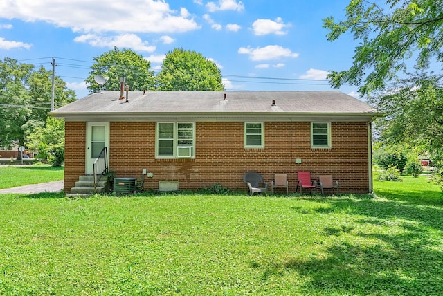 211 Navaho Trl, Hopkinsville, KY 42240 - rear view of property featuring entry steps, a yard, brick siding, and roof with shingles