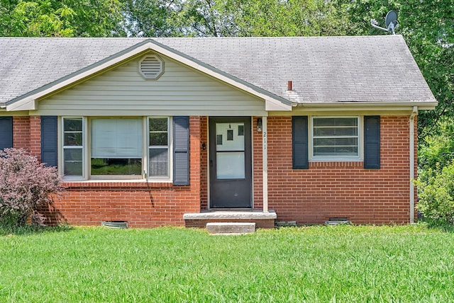 211 Navaho Trl, Hopkinsville, KY 42240 - ranch-style house featuring crawl space, brick siding, a front yard, and a shingled roof